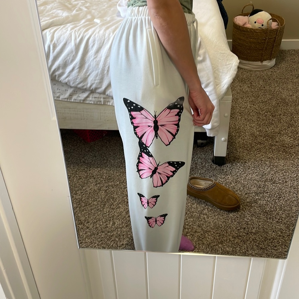White sweatpants with pink butterflies
